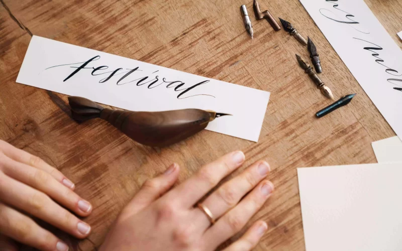 calligrapher-girl-writing-while-working-at-table-i-2026-01-08-05-33-49-utc